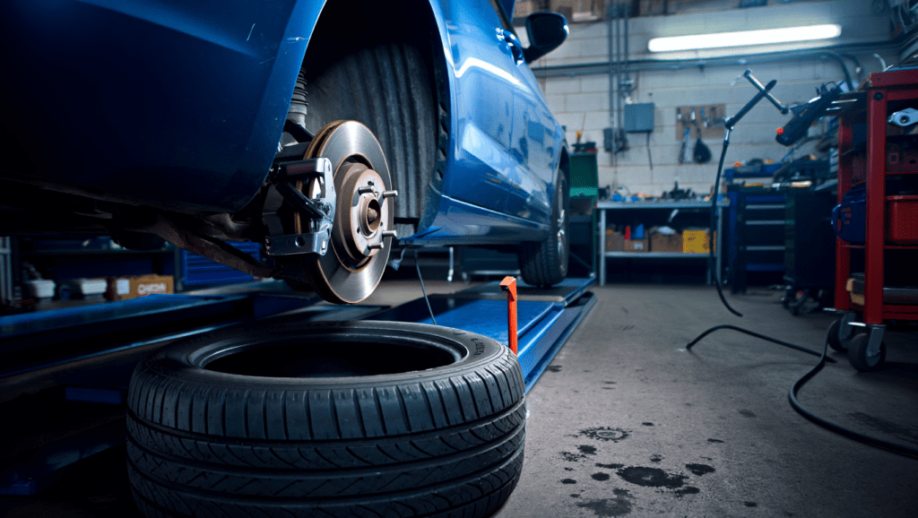 Car undergoing MOT inspection highlighting common failure areas such as tyres and brakes.