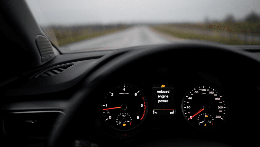 Dashboard showing reduced engine power message during limp mode driving in Medway.